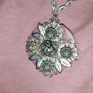 My grandma's sliver colored rose necklace. Only $8